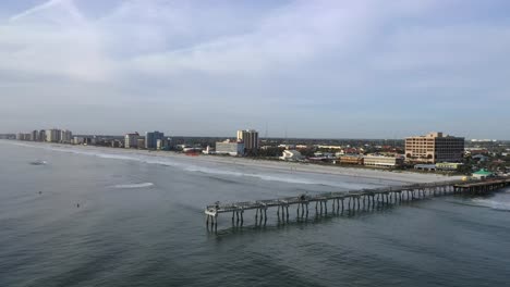 Aerial-View-Of-Jacksonville-Beach-Pier-And-Beachfront-Hotels-In-Florida,-USA