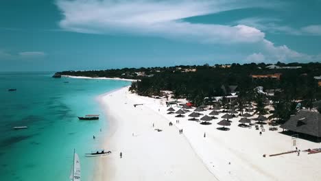 Amacing-aerial-flight-panorama-over-view-drone-shot-at-midday-noon-time-white-sand-beach