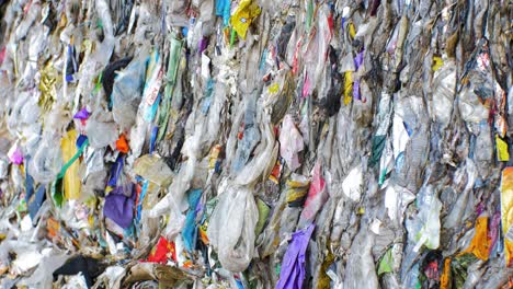 Stack-of-different-types-of-large-garbage-dump,-plastic-bags,-and-landfill-full-of-trash,-environmental-pollution,-medium-close-up-shot-tilt-up