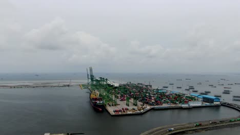 Rising-aerial-of-industrial-container-harbor-Tanjung-Priok,-Indonesia