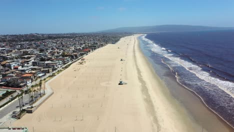 Manhattan-Beach-Pier-and-the-Pacific-Ocean-near-Los-Angeles-California---aerial-pullback
