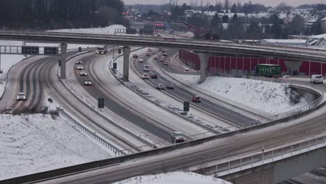 Traffic-moving-slowly-along-snowy-Highway-interchange-in-Germany