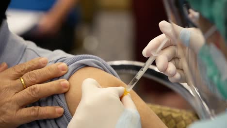 Close-Up-Footage-of-Nurse-Giving-COVID-19-Vaccine-Shot-To-The-Patient