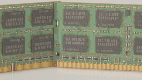 Close-pan-over-RAM-module-sticks-against-a-white-background