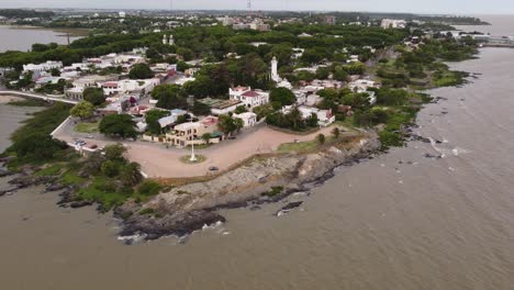Aerial-view-of-historic-town-of-Colonia-del-Sacramento-during-daytime-at-coastline-of-Uruguay