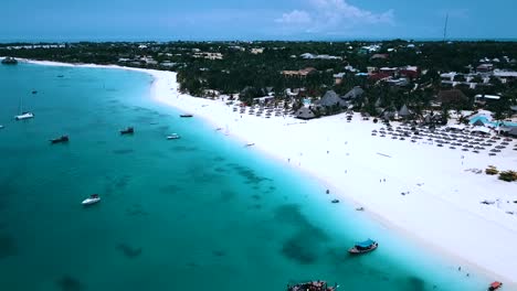 Spectacular-aerial-flight-panorama-overview-drone-shot-a-luxury-resort-hotel-on-a-scenic-tropical-island-on-zanzibar,-africa-tanzania-2019