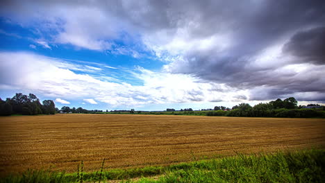 Storm-clouds-building-as-weather-moves-over-harvested-farmland