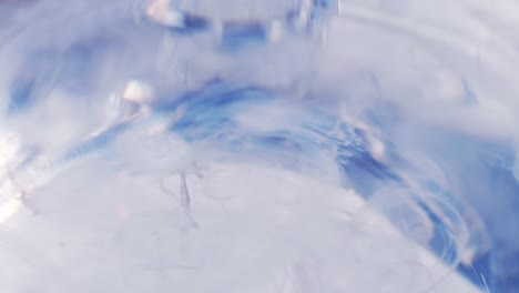 Blur-milk-dripping-into-the-water-slow-motion-and-blue-color-copy-space-background