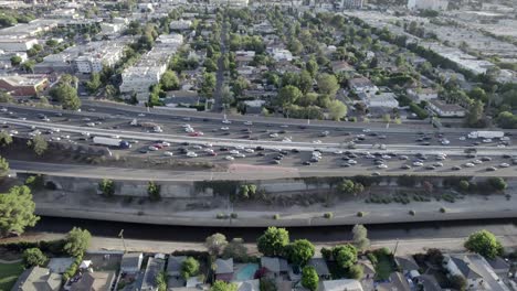 Aerial-view-across-busy-traffic-cars-driving-congestion-on-Hollywood-101-freeway-interchange