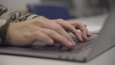 Man-Hands-Working-And-Typing-On-Laptop-Computer-Keyboard,-Close-Up