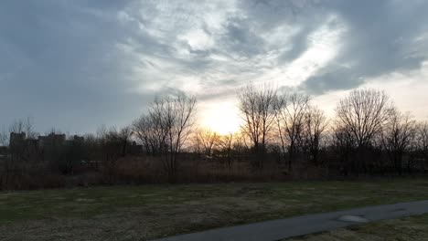 A-low-angle-shot-of-Calvert-Vaux-Park-in-Brooklyn,-NY-during-a-cloudy-sunset