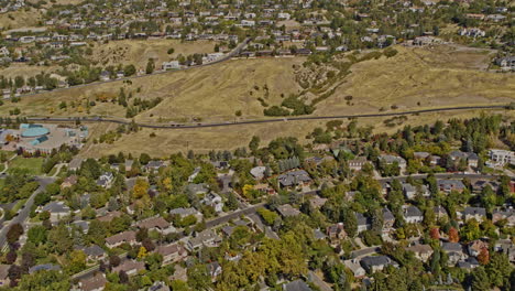 Salt-Lake-City-Utah-Aerial-v63-birds-eye-view-flyover-affluent-hillside-neighborhood,-federal-heights,-tilt-up-reveals-beautiful-mountain-landscape---Shot-with-Inspire-2,-X7-camera---October-2021