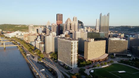 Aerial-drone-view-of-tall-city-architecture-in-sunny-Pittsburgh,-Pennsylvania,-United-states