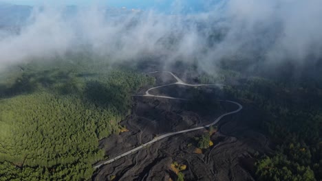 A-road-up-a-volcano-covered-in-low-clouds