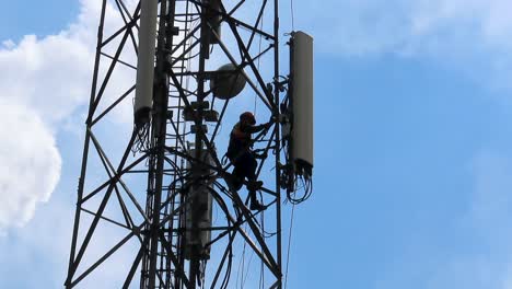 Man-loosening-cell-tower-antenna-for-upgrading-01
