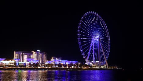 Light-show-on-Ain-Dubai-at-night,-tallest-ferris-wheel-in-the-world-located-on-blue-water-island