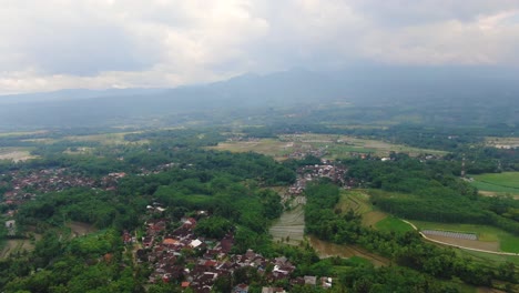 Grabag-village-and-surrounding-landscape,-Indonesia.-Aerial-forward