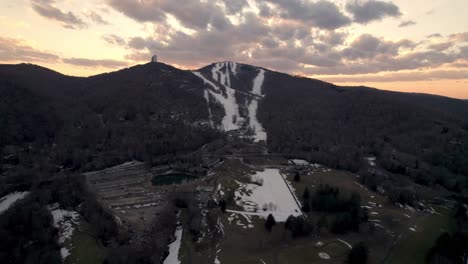 aerial-push-in-to-sugar-mountain-ski-resort-at-sunset