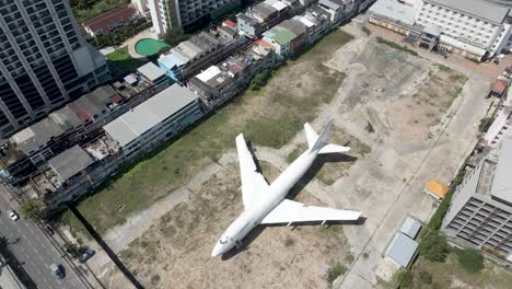 Topdown-view-Discarded-Jumbo-jet-on-Pattaya-Downtown,-Street-food-Project-Concept