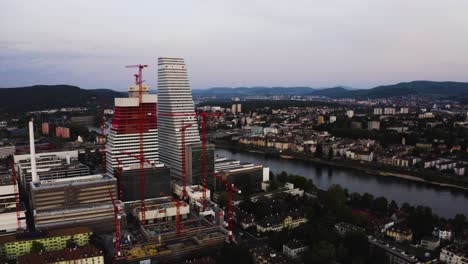 Aerial-shows-the-new-Roche-tower-get-builded-in-Basel,-Switzerland