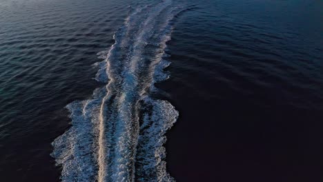 Aerial-drone-shot-of-the-speed-boat-drifting-on-the-ocean-8