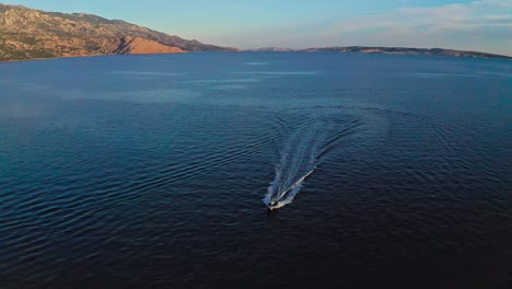 Aerial-drone-shot-of-the-speed-boat-drifting-on-the-ocean-7