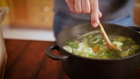 mixing-vegetable-soup-older-hands