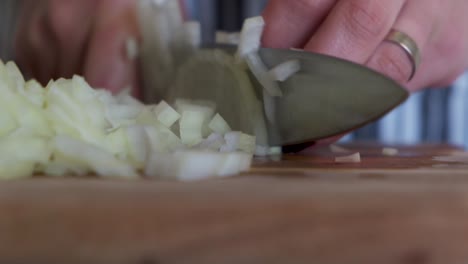 Woman-chopping-onions-on-chopping-board