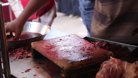 A-street-food-vendor-cutting-meat