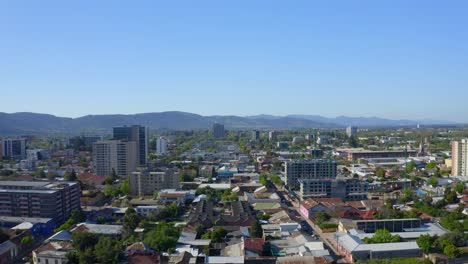 Drone-Shot-travel-left,-city-of-talca-maule-septima-region-Chile-looking-at-the-buildings-in-the-city-center