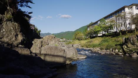Yoshida-River-flowing-through-Gujo-Hachiman-on-warm-Japanese-Summer-Day
