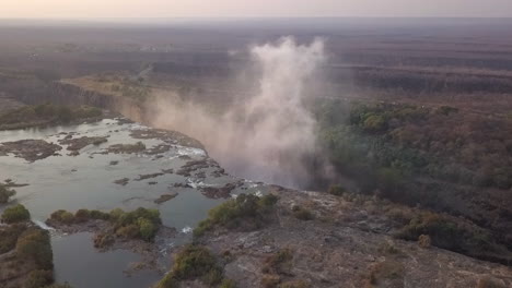 Aerial:-Top-of-Zambezi-Victoria-Falls-with-mist-rising-from-the-gorge