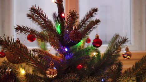 Close-up-shot-of-a-beautifully-decorated-christmas-tree-inside-house