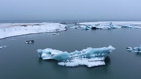 Aerial-view-of-large-glacial-lake-named-Jökulsárlón-in-southern-part-of-Vatnajökull-National-Park,-Iceland