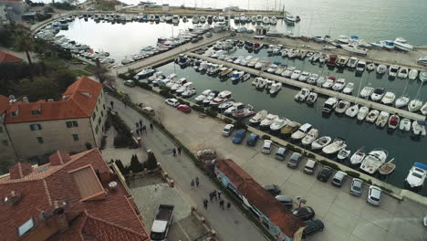 Aerial-Descending-View-Over-Small-Boats-In-Marina,-Split,-Croatia