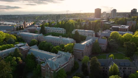 Orbiting-aerial-shot-of-Seattle's-University-of-Washington-campus-at-sunset