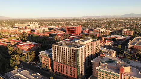 Slow-drone-orbit-around-Tucson-Graduate-Hotel-and-Marriott-Hotel,-showing-panorama-view-of-city