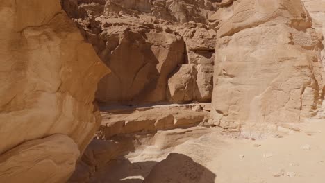 Tilt-Shot-View-Of-Rocky-Colored-Canyon-In-South-Sinai,-Egypt,-On-Sunny-Day