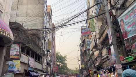 View-from-Bangladesh-buildings-down-to-local-street-food-market,-tilt-down