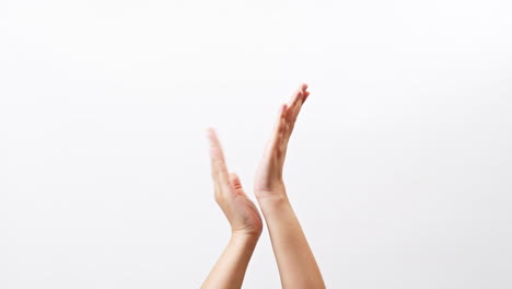 Close-up-of-Woman's-hand-clapping-celebrating-applause-doing-the-hand-gesture-isolated-on-a-white-studio-background-with-copy-space-for-place-a-text-message-for-advertisement-promote-a-product