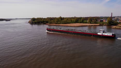 Aerial-Port-Side-View-Of-Da-Vinci-Motor-Tanker-Ship-Navigating-Along-Oude-Maas