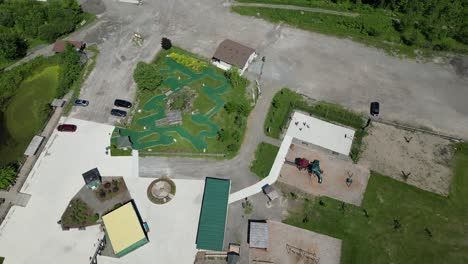 Aerial-of-miniputt-course-and-basketball-court-in-Heartland-Forest,-Niagara
