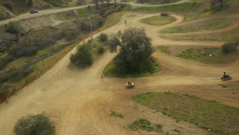 Beautiful-4k-aerial-footage-of-dirt-bikes,-ATVs-and-Quads-in-desert-mountains-of-California