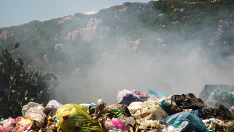 Close-up-shot-of-burning-trash,plastic-and-garbage-in-Vietnam-during-summer