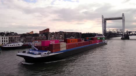 Aerial-Port-Side-View-Of-Sensation-Cargo-Ship-Along-Oude-Maas-After-Passing-through-Spoorbrug-Railway-Bridge
