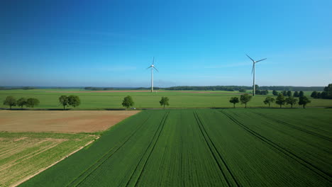 Alternative-Energy-Production-in-Wind-Turbine-Farm,-Roadtrip-on-Countryside