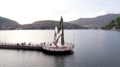 Cinematic-Aerial-Orbit-of-the-Life-Electric-Sculpture-at-Lake-Como,-Italy