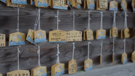 Ema-Prayer-wooden-tags-hanging-up-at-Meoto-Iwa-Shrine-on-Coast-of-Mie