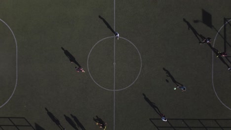 Top-drone-view-of-players-in-a-football-field-in-south-Mexico-City