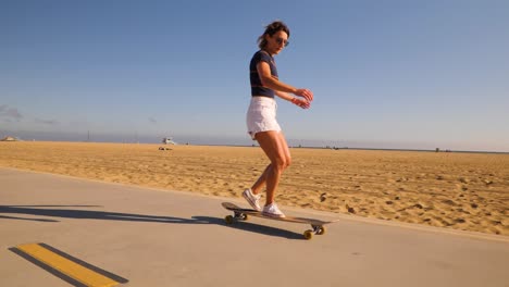 Portrait-Of-A-Woman-In-Extreme-Sport,-Riding-A-Skateboard-During-Summertime